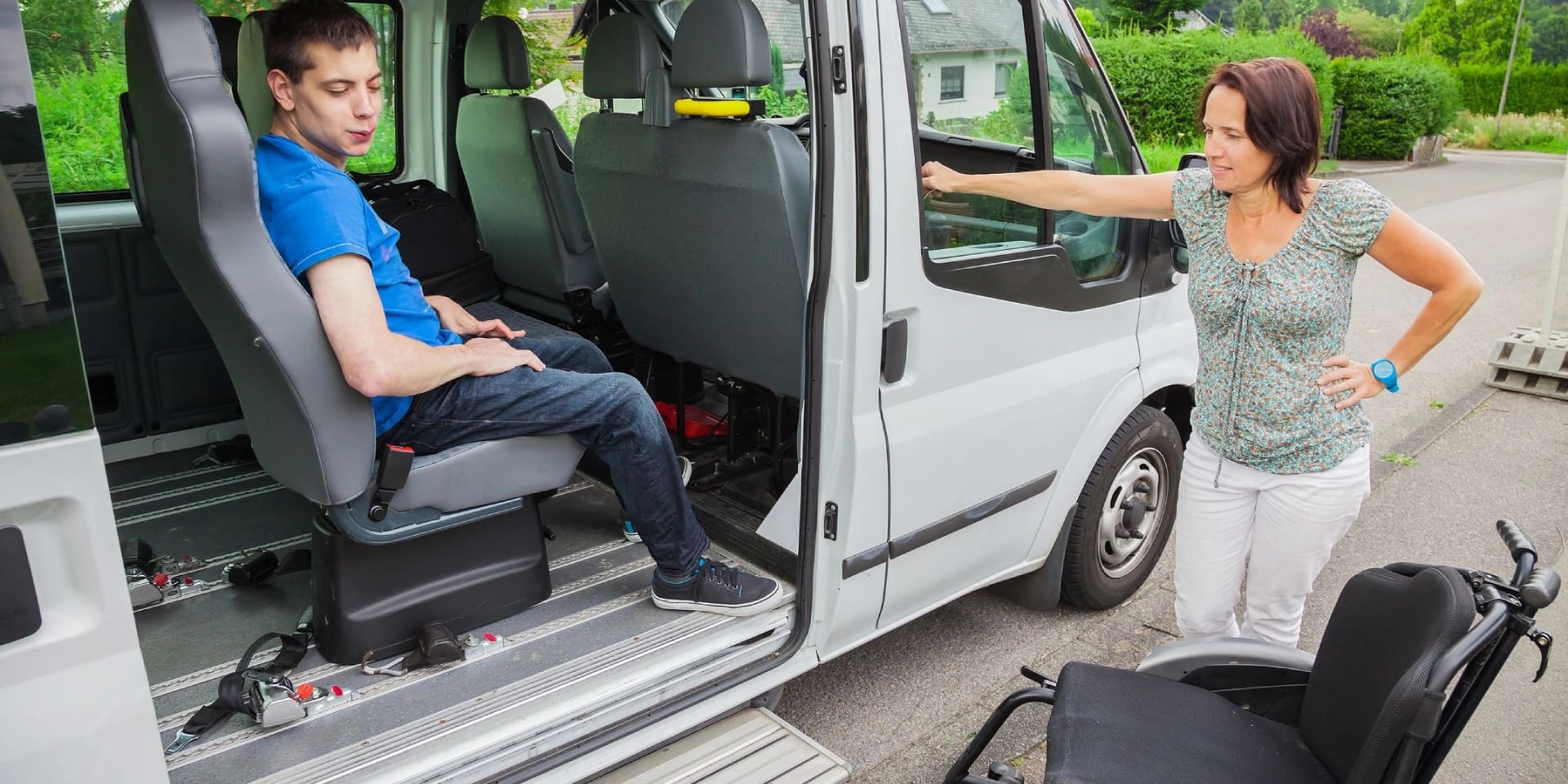 A man sitting in the back of a van.