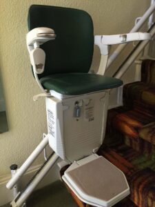 A stair lift sitting on top of a staircase.