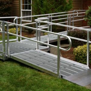 A metal ramp with handrails going up to the side of it.